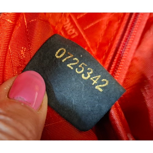 11 - Longchamp- A black leather crossbody bag, 26cm wide x 26cm high, having silver tone hardware, red br... 