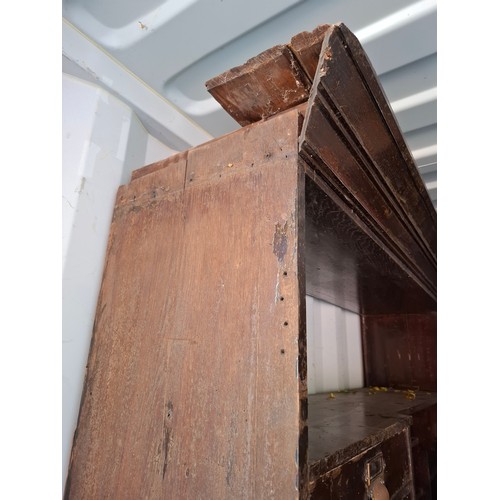 13 - An early 20th Century very large mahogany stained oak shop display cabinet on a plinth base having 1... 