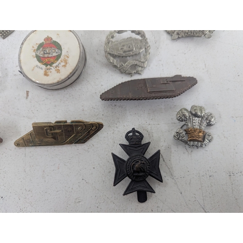 22 - ***THIS LOT HAS BEEN WITHDRAWN*** A collection of military cap badges to include a selection of exam... 