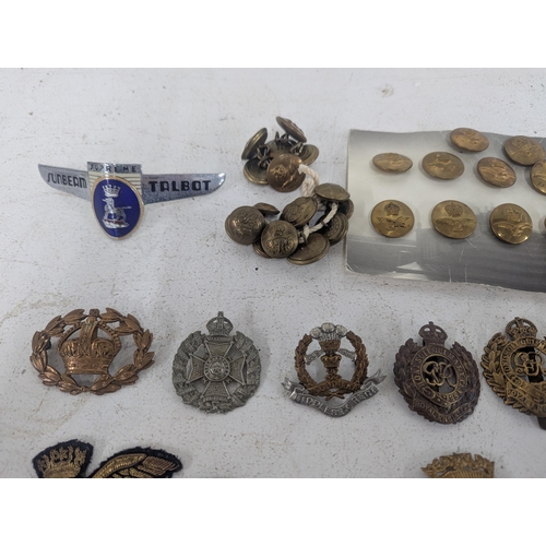22 - ***THIS LOT HAS BEEN WITHDRAWN*** A collection of military cap badges to include a selection of exam... 