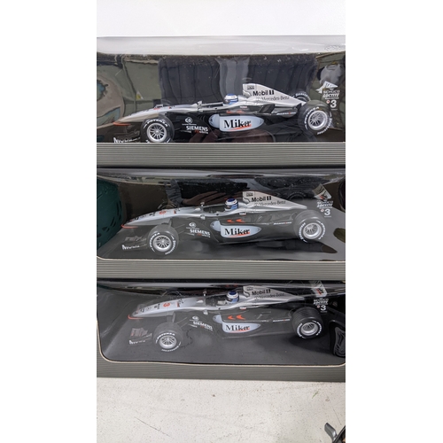 A collection of boxed model cars to include three Mercedes Benz from ...