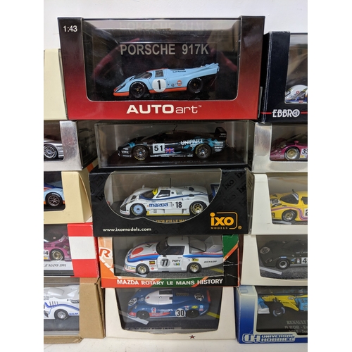 Twenty-five cased model racing cars to include Le Mans racing cars ...