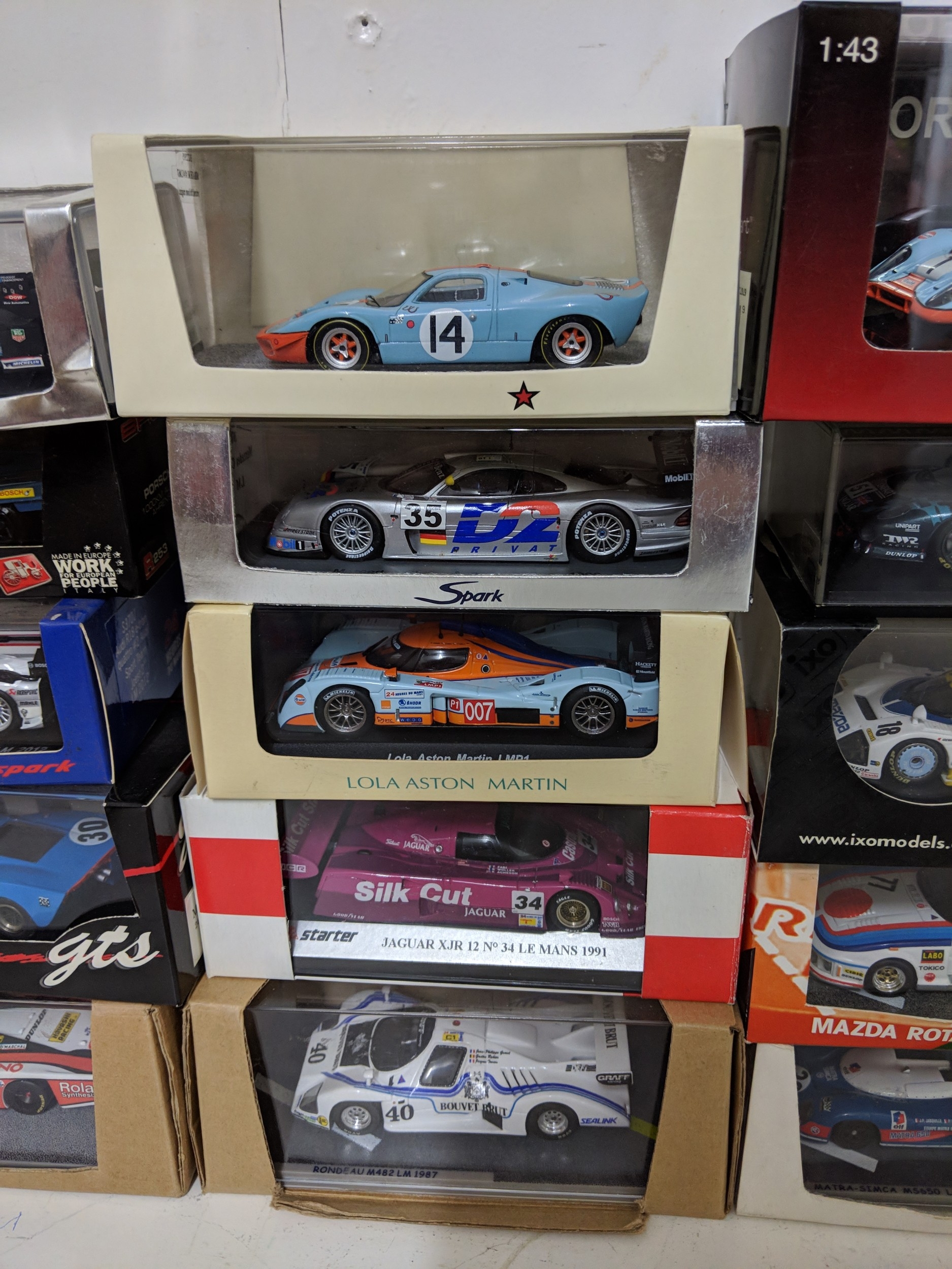 Twenty-five cased model racing cars to include Le Mans racing cars ...