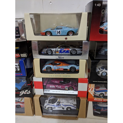 Twenty-five cased model racing cars to include Le Mans racing cars ...