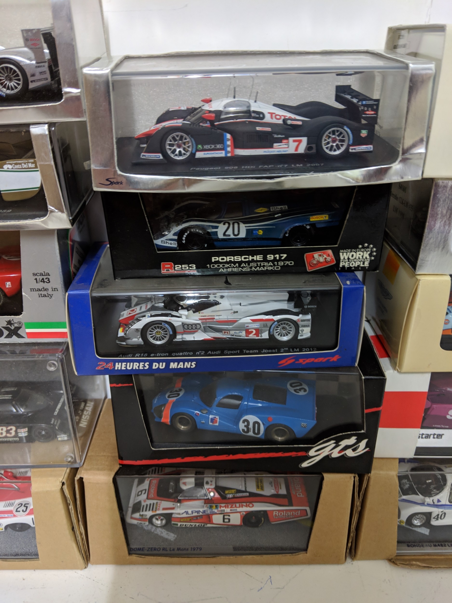 Twenty-five cased model racing cars to include Le Mans racing cars ...