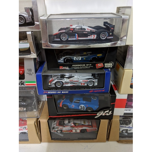 Twenty-five cased model racing cars to include Le Mans racing cars ...