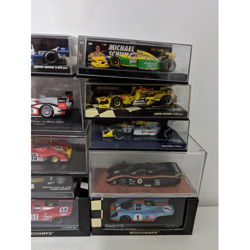 Twenty five cased model racing cars to include Le Mans and Daytona ...