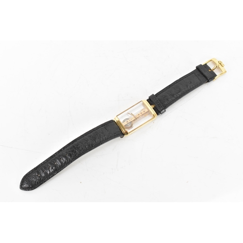 20 - A Corum Golden Bridge, manual wind, gents, 18ct gold wristwatch, the skeleton dial having 18K engrav... 