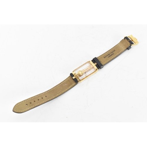 20 - A Corum Golden Bridge, manual wind, gents, 18ct gold wristwatch, the skeleton dial having 18K engrav... 