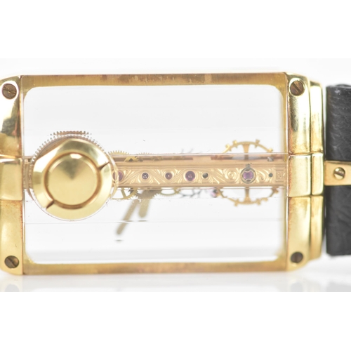 20 - A Corum Golden Bridge, manual wind, gents, 18ct gold wristwatch, the skeleton dial having 18K engrav... 