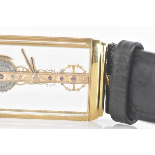 20 - A Corum Golden Bridge, manual wind, gents, 18ct gold wristwatch, the skeleton dial having 18K engrav... 