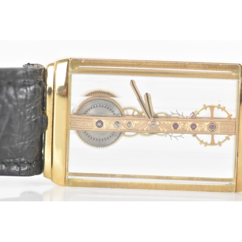 20 - A Corum Golden Bridge, manual wind, gents, 18ct gold wristwatch, the skeleton dial having 18K engrav... 