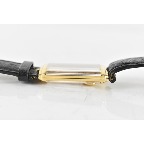 20 - A Corum Golden Bridge, manual wind, gents, 18ct gold wristwatch, the skeleton dial having 18K engrav... 