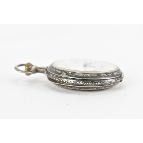 23 - A late 19th century continental silver and niello open face pocket watch, the white enamel dial with... 