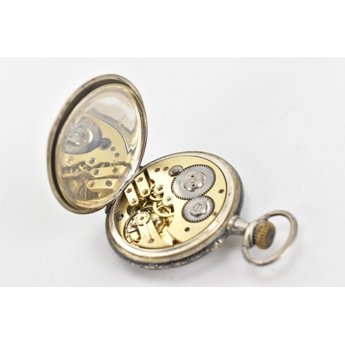 23 - A late 19th century continental silver and niello open face pocket watch, the white enamel dial with... 
