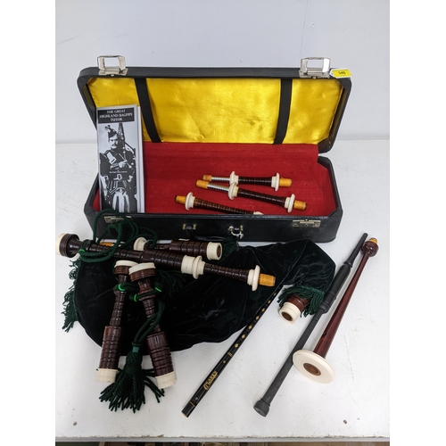 346 - A cased set of bagpipes with practise chanter, and a Clarke's flute.
Location: A2M
If there is no co... 