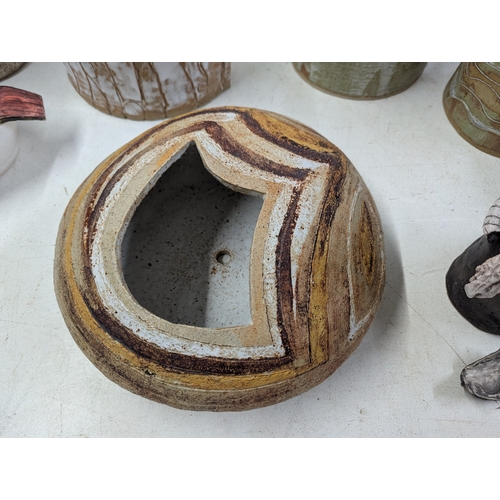 309 - Studio pottery to include vases and other examples, some signed TJT
Location: 1-2
If there is no con... 