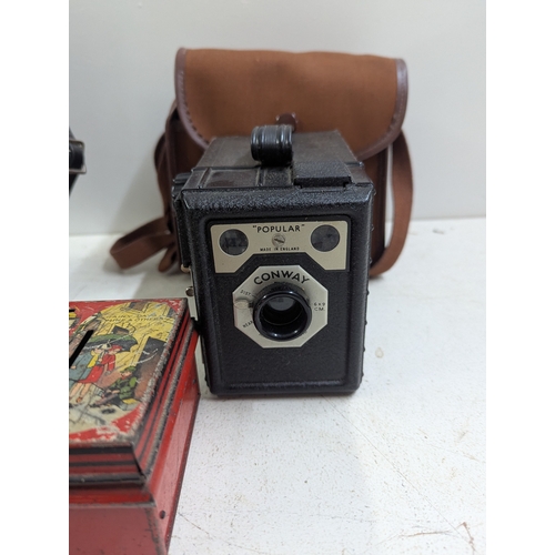 38 - A mixed group of collectables to include Robertsons Advertising Gollies, a vintage money tin and oth... 