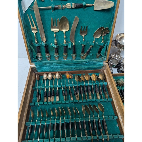 57 - Mixed metalware to include a selection of silverplated trophy cups together with a Thai bronze and w... 