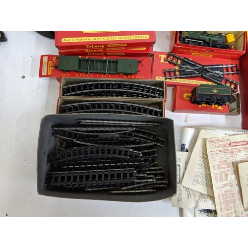 335 - Triang 00/H0 gauge railway track, carriages and other accessories to include buildings and power- pa... 