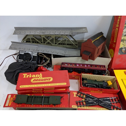 335 - Triang 00/H0 gauge railway track, carriages and other accessories to include buildings and power- pa... 