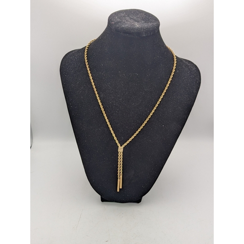 101 - A 9ct yellow gold rope twist necklace with two tasselled ends and a lobster claw clasp, 6.6g
Locatio... 