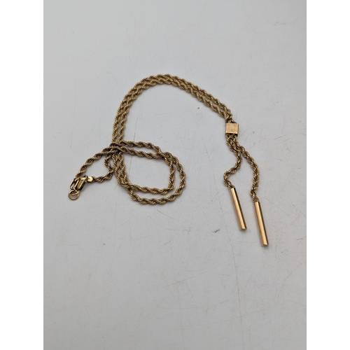 101 - A 9ct yellow gold rope twist necklace with two tasselled ends and a lobster claw clasp, 6.6g
Locatio... 