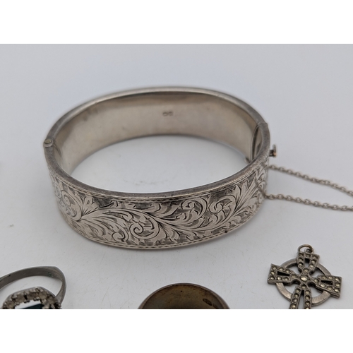 105 - A mixed group of jewellery and three ladies wristwatches to include a silver bangle, 28.6g, gold pla... 