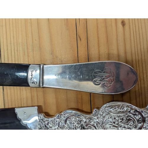 107 - Three silver handled and tortoiseshell page turners, one example by Mappin & Webb Ltd, hallmarked Bi... 