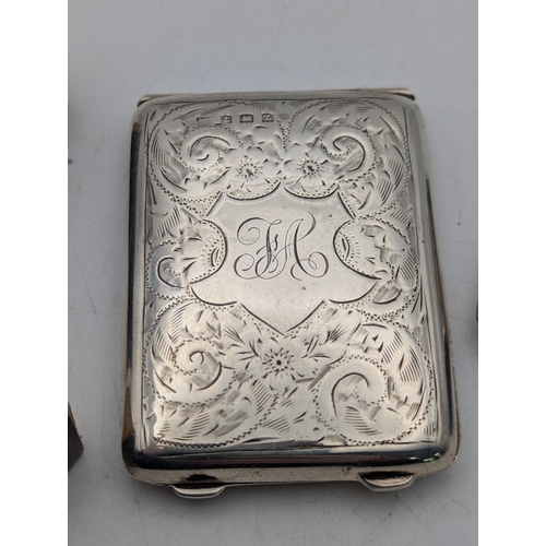 110 - A group of silver items to include a floral engraved match stick case, a vesta case and two matchbox... 