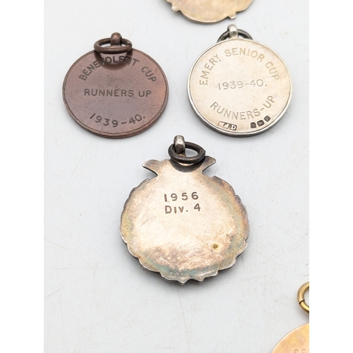 110 - A group of silver items to include a floral engraved match stick case, a vesta case and two matchbox... 