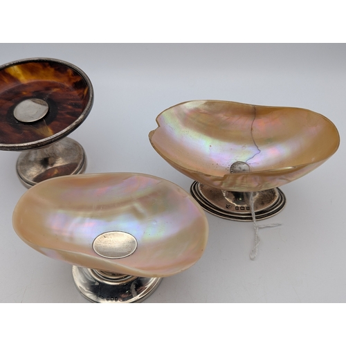 117 - Two silver and mother of pearl salt dishes, together with a silver and tortoise shell pedestal pin d... 