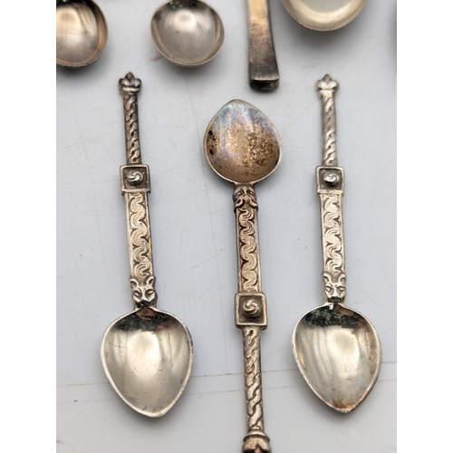 65 - A selection of white metal tea and coffee spoons to include tourist examples and others, total weigh... 