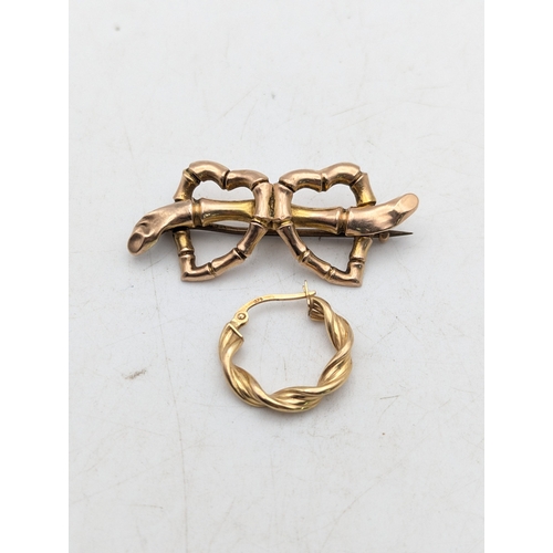 67 - A 9ct yellow gold love heart brooch, later pin and one 9ct gold hoop earring, total weight 2.7g
Loca... 