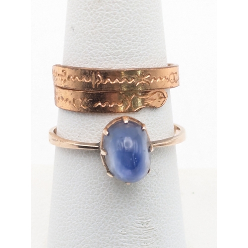 93 - A blue sapphire cabochon claw set on a yellow metal shank, tested as 9ct gold size Q 1/2, 2.4g and a... 