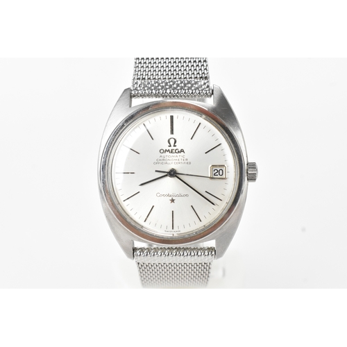 An Omega Constellation, automatic chronometer, gents, stainless steel wristwatch, circa 1966, the silvered dial with baton hour markers, date aperture at 3 o’clock, and centre seconds, on a later stainless steel mesh bracelet, calibre 564 movement, numbered 24837455, 34.5mm Watch is in ticking order 
If there is no condition report shown, please request