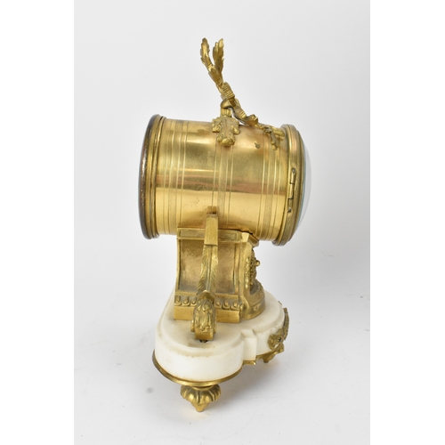 26 - A 19th century French gilt metal and marble mantle clock, the white enamel dial having Arabic numera... 