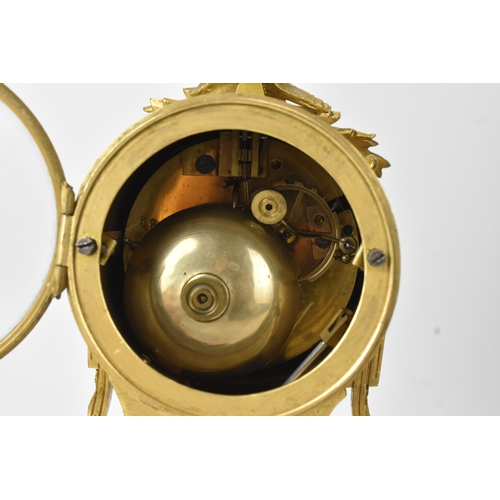 26 - A 19th century French gilt metal and marble mantle clock, the white enamel dial having Arabic numera... 