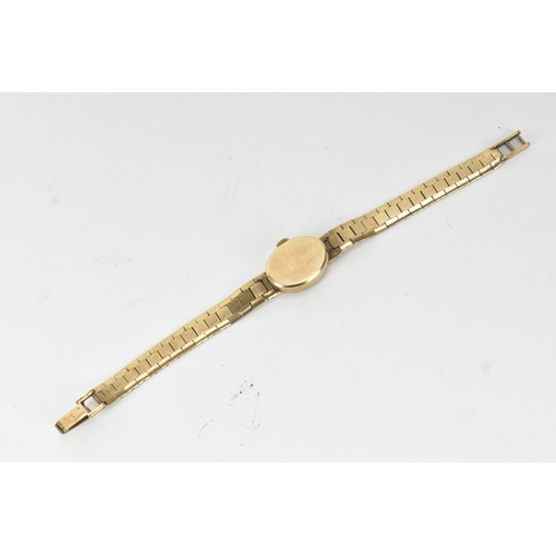 42 - A Rotary, manual wind, ladies, 9ct yellow gold wristwatch, circa 1970s, the oval textured gold-tone ... 