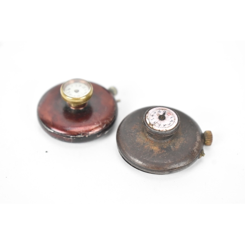 45 - Two early 20th century Swiss gunmetal cased button hole / lapel watches, each having a white enamel ... 