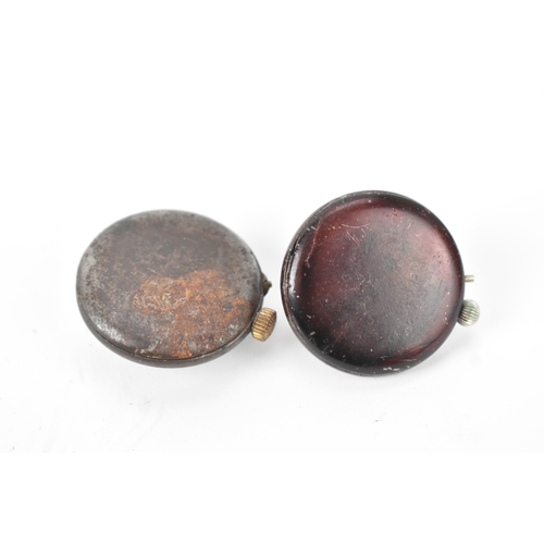 45 - Two early 20th century Swiss gunmetal cased button hole / lapel watches, each having a white enamel ... 