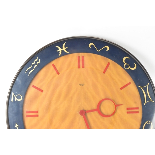 48 - A mid-20th century Smiths electric ‘Zodiac’ wall clock, the circular dial with red baton numerals an... 