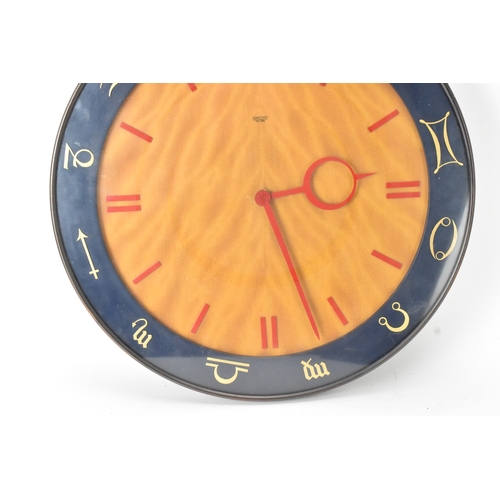 48 - A mid-20th century Smiths electric ‘Zodiac’ wall clock, the circular dial with red baton numerals an... 