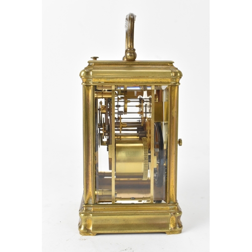 49 - A late 19th/early 20th century gilt brass repeater carriage clock, the white enamel dial signed 'T.M... 