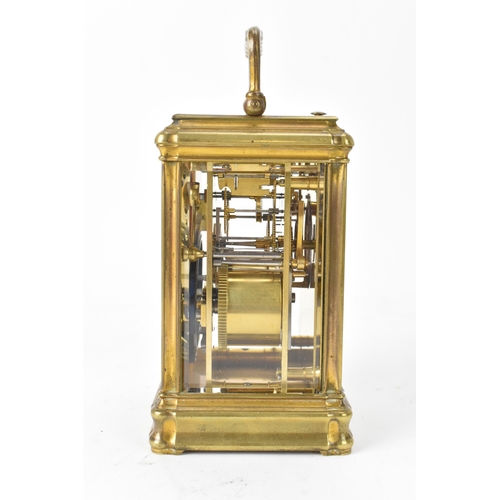 49 - A late 19th/early 20th century gilt brass repeater carriage clock, the white enamel dial signed 'T.M... 