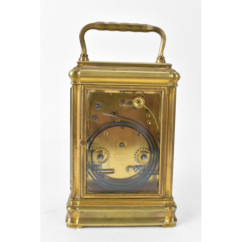 49 - A late 19th/early 20th century gilt brass repeater carriage clock, the white enamel dial signed 'T.M... 