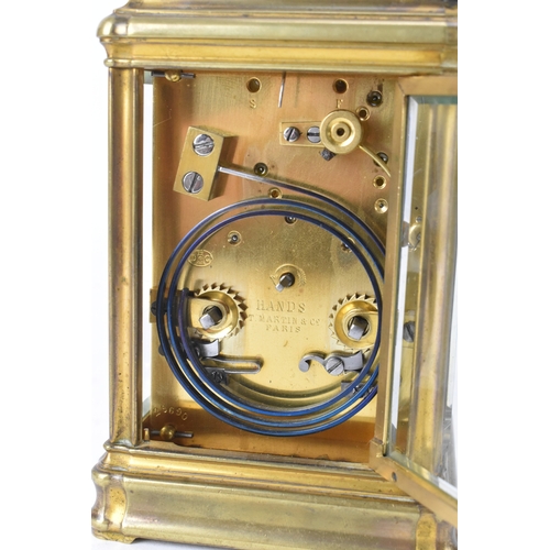 49 - A late 19th/early 20th century gilt brass repeater carriage clock, the white enamel dial signed 'T.M... 