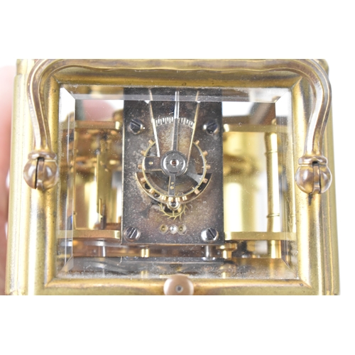 49 - A late 19th/early 20th century gilt brass repeater carriage clock, the white enamel dial signed 'T.M... 