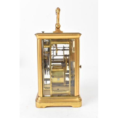 50 - A late 19th/early 20th century gilt brass repeater carriage clock, the white enamel dial with Roman ... 