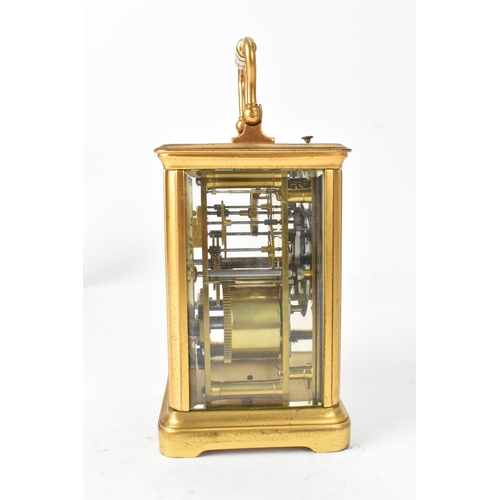 50 - A late 19th/early 20th century gilt brass repeater carriage clock, the white enamel dial with Roman ... 